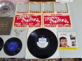 License plate frames, 25 year award 1961-1986, 12 Lincoln coffee mugs, rare dealership advertising records, tray with Studebaker Avanti automobile, etc.