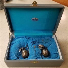 Set of salt cellar & spoon, and pepper shaker, both with figural bird on a leafy branch finials. Unmarked sterling silver. In original presentation box from the Tokyo Silverware Company.