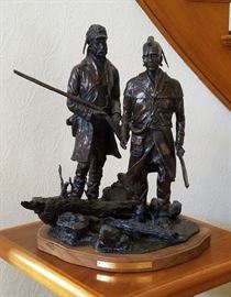 Large 20" tall bronze sculpture of a mountain man and a Native American standing side by side, entitled "Confederates of the Fur trade", #14/20, by well known listed artist Truman Bolinger (Arizona/Wyoming, 1944-current), 20" x 18" x 18"