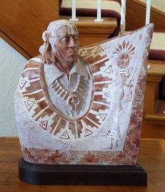 Alabaster stone sculpture of a Navajo with raised arm decorated with pictugraphs, by listed artist Alvin K. Marshall (New Mexico, 1959-current), 14" tall, 13" wde, and 5" deep