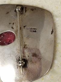 Sterling silver brooch set with semi-precious purple stone by Ed Weiner (1918-1991). Ed Weiner was one of the most talented and respected modernist jewelry designers of the early years of the New York wearable art movement. Though almost entirely self taught, he possessed a fine appreciation of form, line, and color. Most of his work, like this piece, was in silver. I have not polished it.