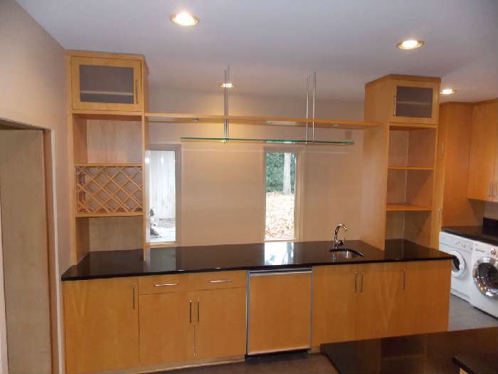 kitchen cabinets granite counter tops wine rack mini refrigerator bar sink 