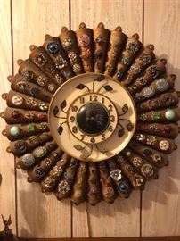 Vintage costume jewelry attached to a mid century wall clock.