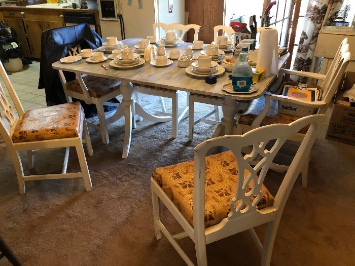 Shabby chic painted dinning table.  Windex/paper towels and the stray coat not included.