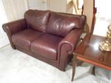 Brown leather loveseat