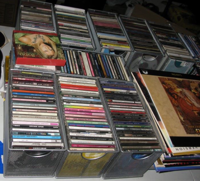 so very many CD's and 33 1/3 RPM albums.. stacks and stacks. 