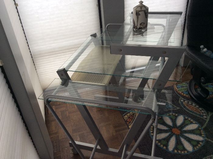 Another photo of glass and metal desk. 