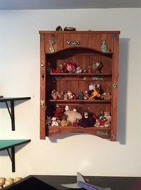 Cabinet full of antique teddy bears.  Cabinet sold separately. 