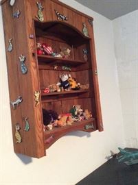Another photo of the wall mounted teddy bear cabinet. 