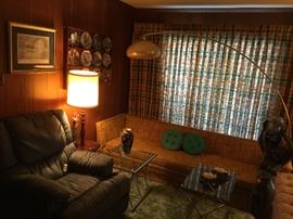 Super Sofa! Glass top tables, electric recliner. Check out the big arc lamp!