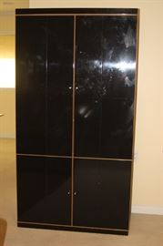 Tall black storage cabinet.