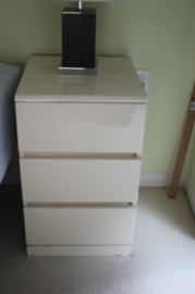 White three drawer night stand.