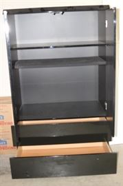Inside of cabinet with drawers and shelves.