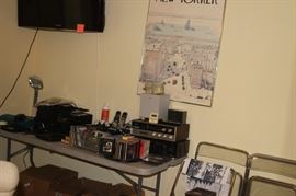 Stereo components, CDs, DVDs, HP printer. Lucite folding chairs.