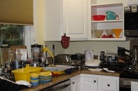 Kitchen items including enameled casseroles.