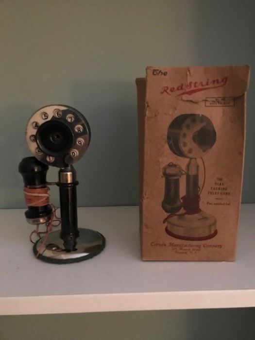 "Red String" toy dial telephone with original box.