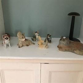 Group of animals: L-R ; stafforshire pug with basket; dog; china cat; china cat; china dog; cast iron cat and  a hand painted vintage hat display.