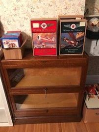 Oak stackable bookcase with top and base.  Texaco collector series in unopened boxes.