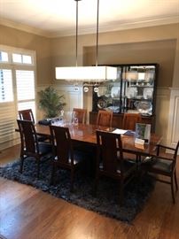 Mid century modern dining table.  Brand new, plastic covering still on chairs.