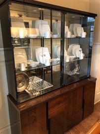 Mid century modern china cabinet with china collection.