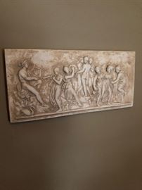 Signed sculpted artwork.