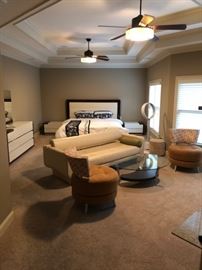 Master suite includes mid century modern bed, dresser, Natuzzi leather couch, modern coffee table and mid century side chairs.