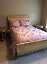 Bedroom suit including sleigh bed, side tables and dresser.