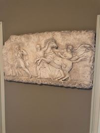 Signed sculpted artwork.