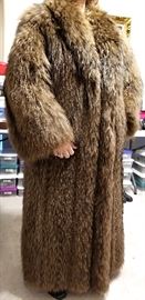 Full length coat with heavy pelts - we believe that this one is coyote (we've sold one before).