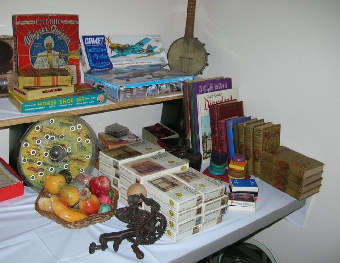 Vintage games including a Whizzer Quizzer! Plane models, a BANJOLELE, Tom Swift books, House of Miniatures doll house furniture kits, Alabaster fruit and eggs.