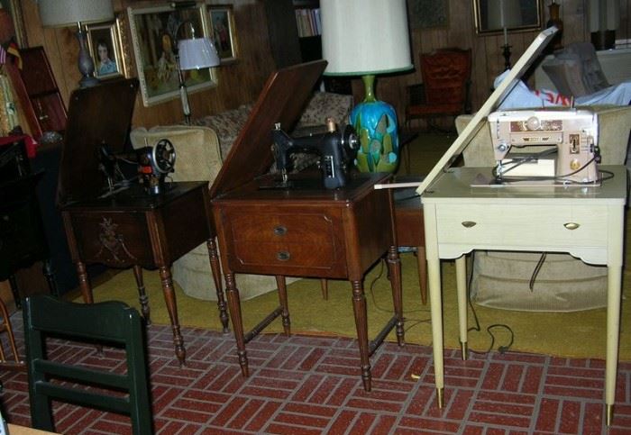 3 - count 'em -- 3! sewing machines in cabinets