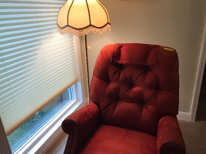 Red recliner and floor lamp