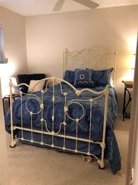 Antique iron bed painted white (Photo by BC)