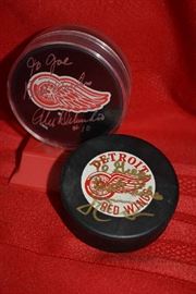 AUTOGRAPHED RED WINGS PUCKS