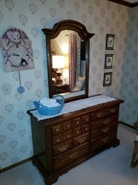 Master bedroom set dresser with attached mirror.