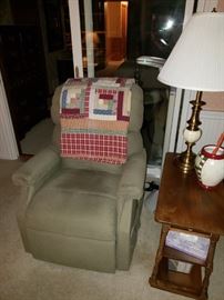 Geriatric lift recliner -- works great!  End table, lamp, reading lamp, quilt.