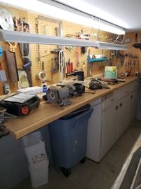 Work bench full of tools.