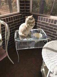 Ceramic cats, wrought iron glass top table
