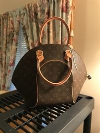 Louis Vuitton clam shell handbag.  Not real, but great shape and very nice.
