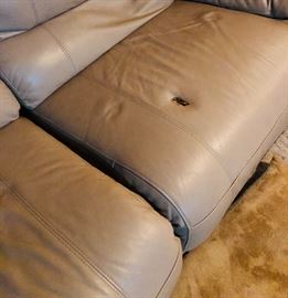 Yep, it has a whole in the upholstery which is a bummer.  This is the electrical recliner piece of the sectional.  The whole does not effect the functionality.    