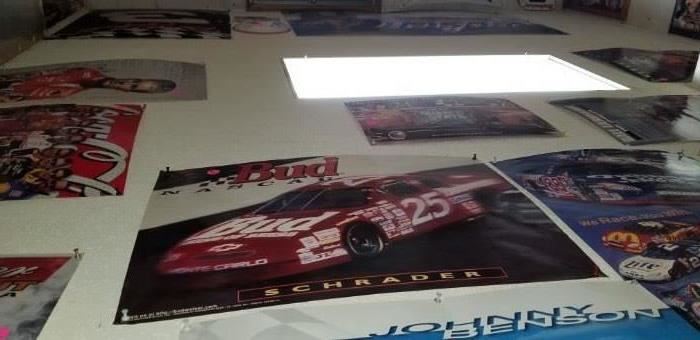 Collection of Nascar Posters pinned up on the ceiling.