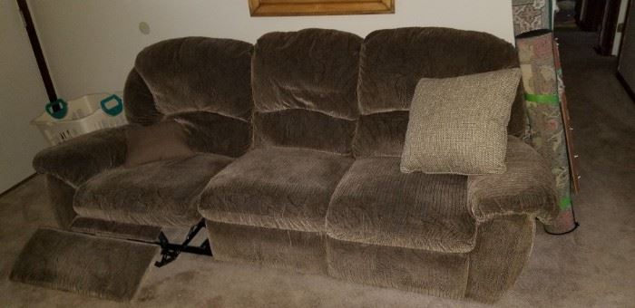 There are 2 of these recliner couches in the living room