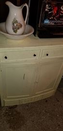 Painted cabinet with washbowl and pitcher
