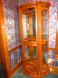 Oak bow front display cabinet, lighted