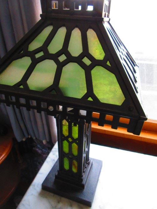 Cast iron arts and crafts lamp with slag glass