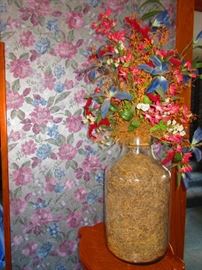 Floral arrangement in large glass container