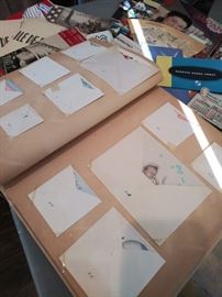 Scrapbook of vintage baby announcements and cards