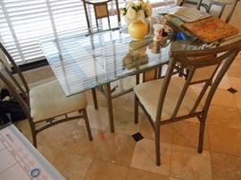 Glass-topped table and chairs
