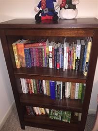 pretty bookcase with lots of newish  books