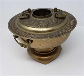 	A Vintage Korean Hot Pot / bulgogi bowl made from shell casing. 
Purchased in Korea  circa 1960's.